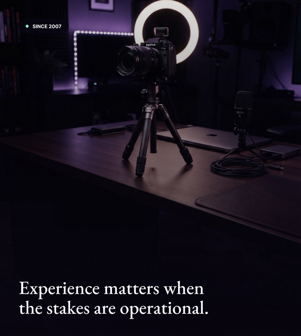 Creative studio workspace with lighting equipment and production gear.
